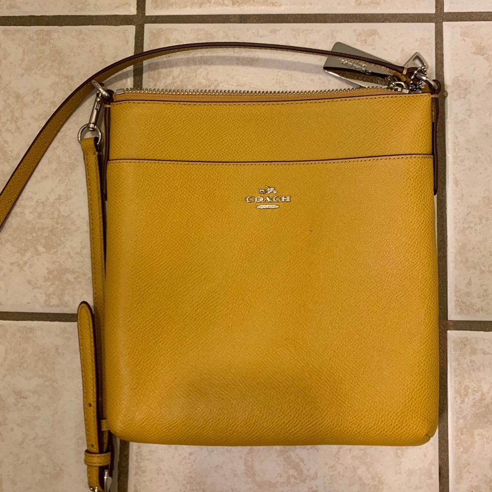 Mustard coach purse- never used